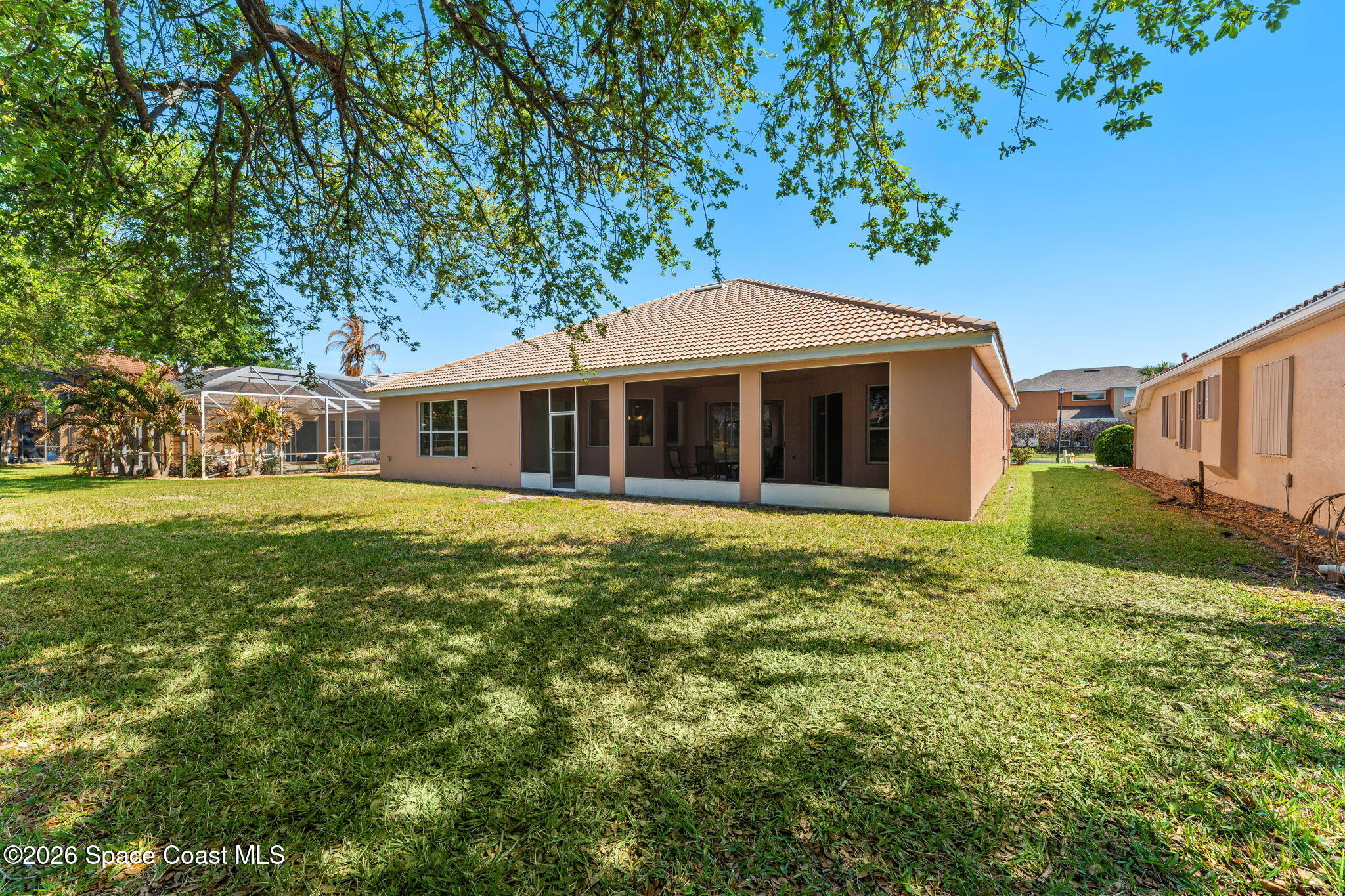 541 Oceanside Boulevard Indialantic, FL 32903 - Photo 34 of 51 a front view of a house with a garden