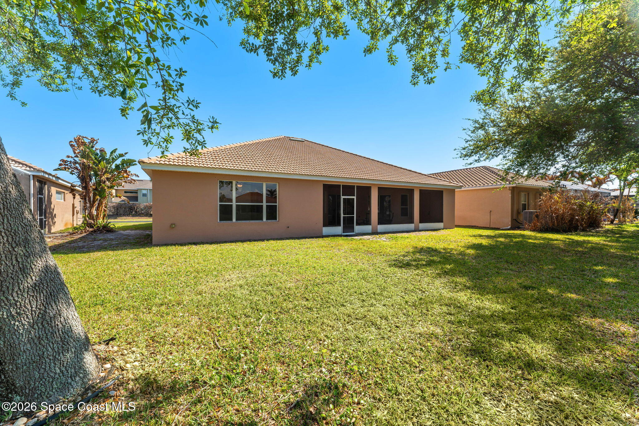 541 Oceanside Boulevard Indialantic, FL 32903 - Photo 35 of 51 a front view of a house with a garden