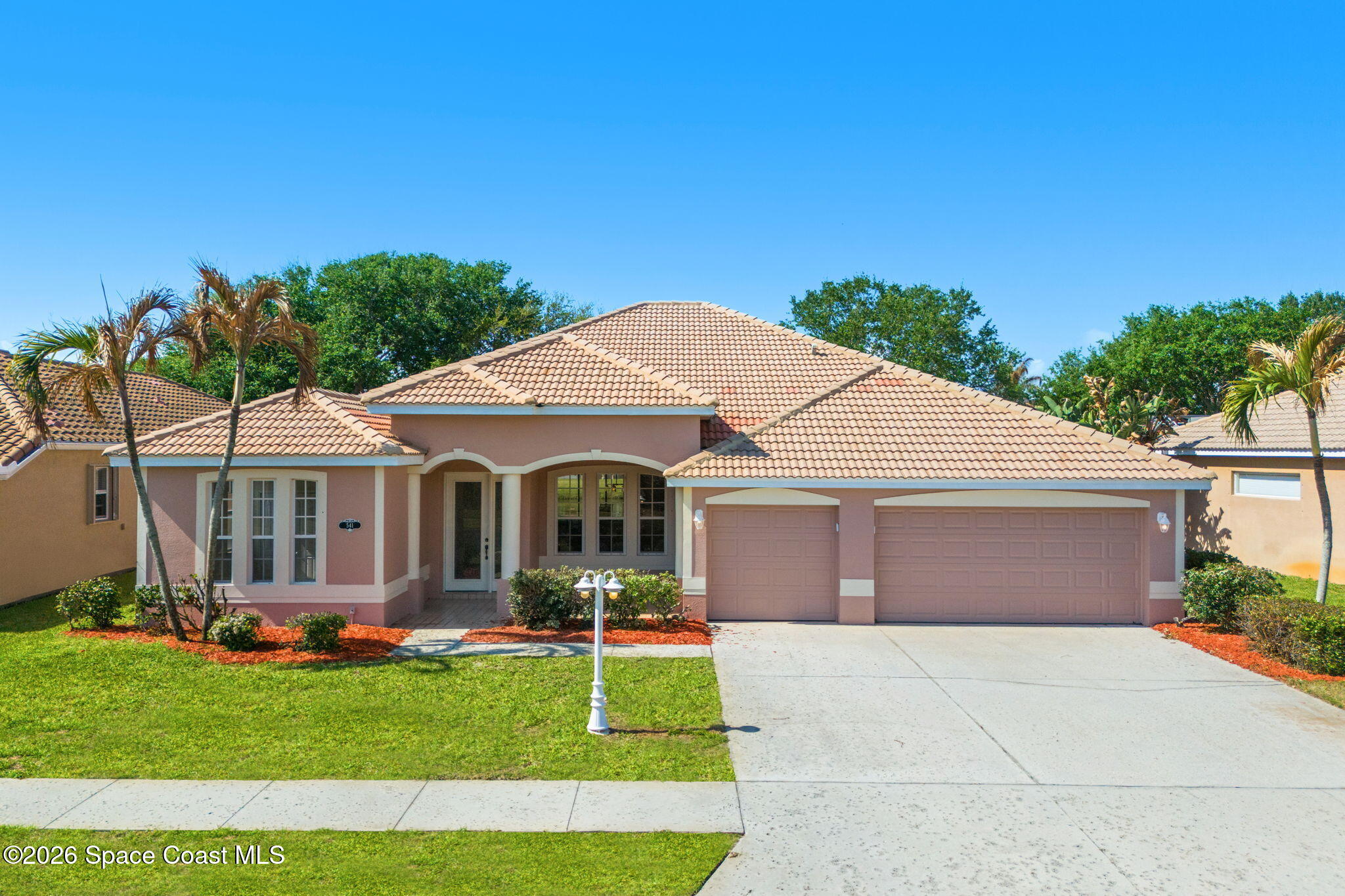 541 Oceanside Boulevard Indialantic, FL 32903 - Photo 39 of 51 a front view of house with yard and green space