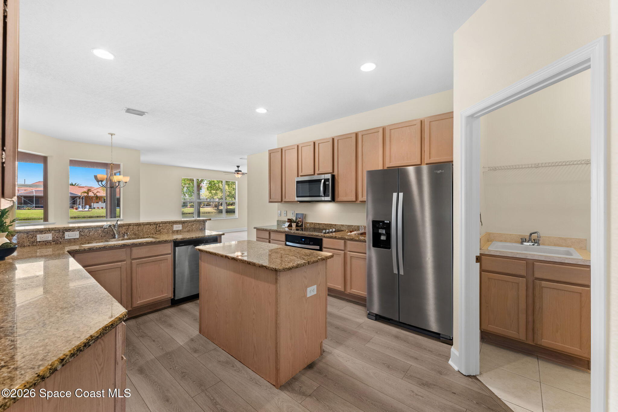 541 Oceanside Boulevard Indialantic, FL 32903 - Photo 10 of 51 a kitchen with a sink refrigerator and microwave
