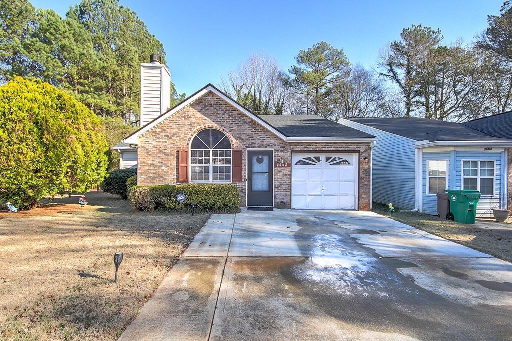 3662 Silver Springs Court Decatur, GA 30034 - Photo 1 of 1 a front view of a house with a yard and garage