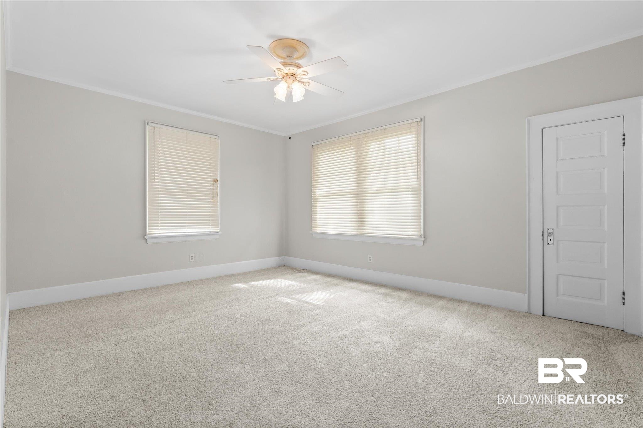 211 3rd Street Mobile, AL 36611 - Photo 12 of 20 Empty room with ceiling fan and light carpet