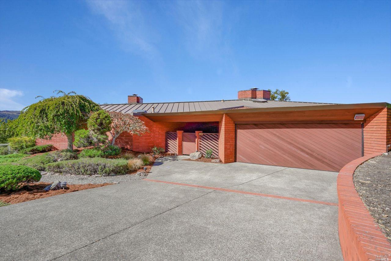 4804 Skycrest Way Santa Rosa, CA 95405 - Photo 1 of 1 a front view of a house with a yard and garage