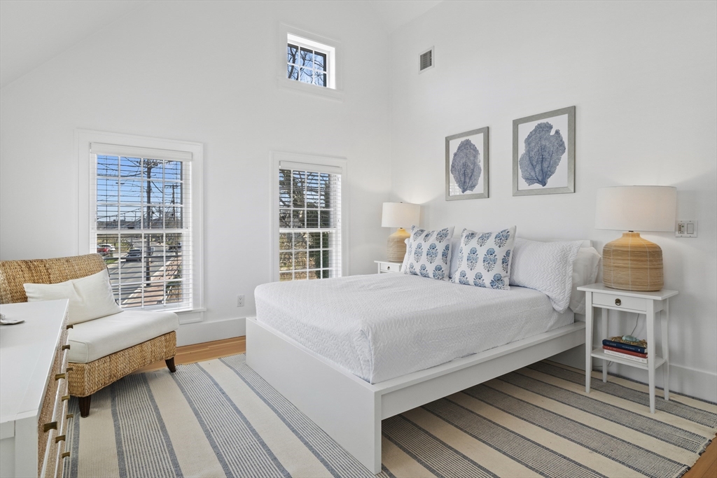 25 Washington Street Nantucket, MA 02554 - Photo 7 of 13 a bedroom with a bed and wooden floor
