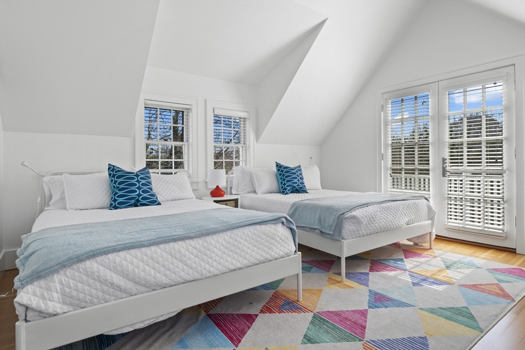 25 Washington Street Nantucket, MA 02554 - Photo 8 of 13 a bedroom with a bed and wooden floor