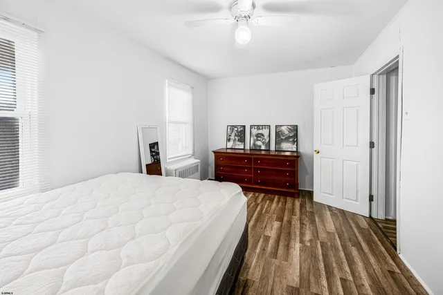 a room with a chair and a chandelier