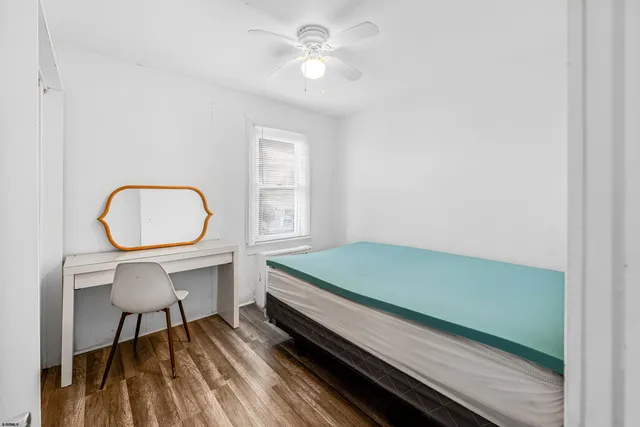 a living room with a bed and a table