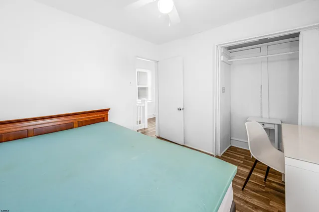 a room with pool table and windows