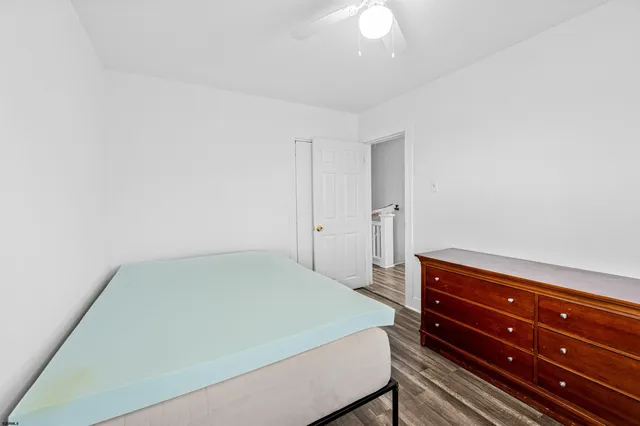 a bathroom with a bathtub a window and a shower