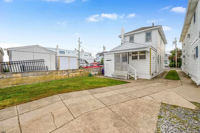 a front view of a house with parking