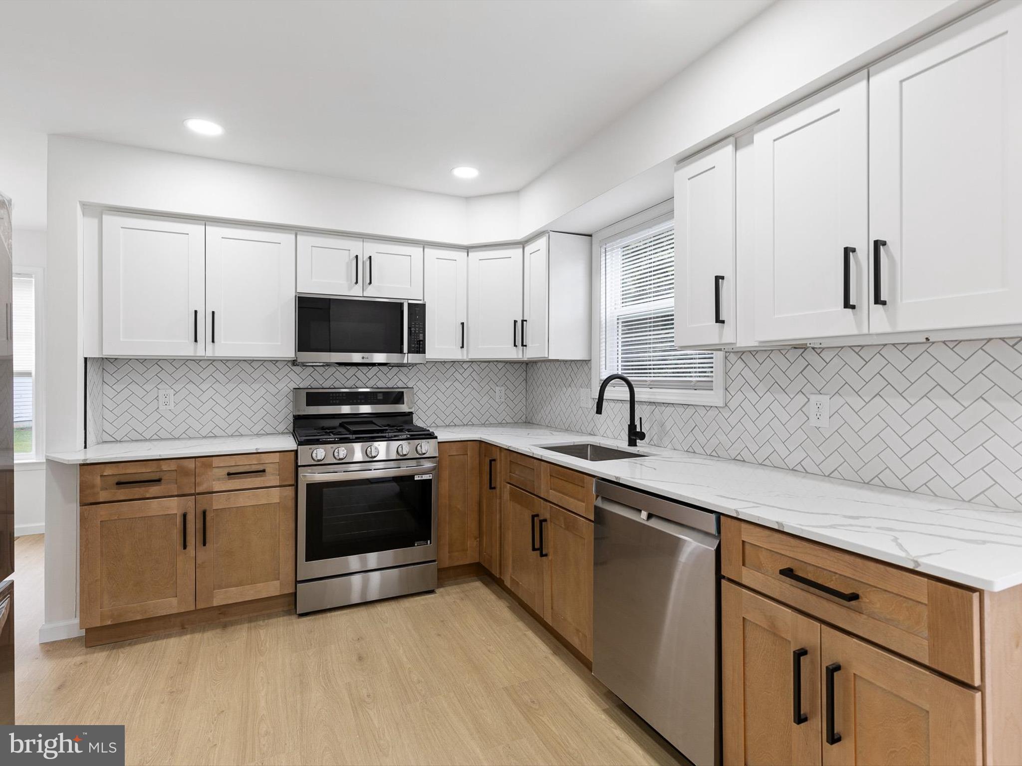 14 3 Rivers Court Newark, DE 19702 - Photo 2 of 21 a kitchen with stainless steel appliances granite countertop a sink and a stove