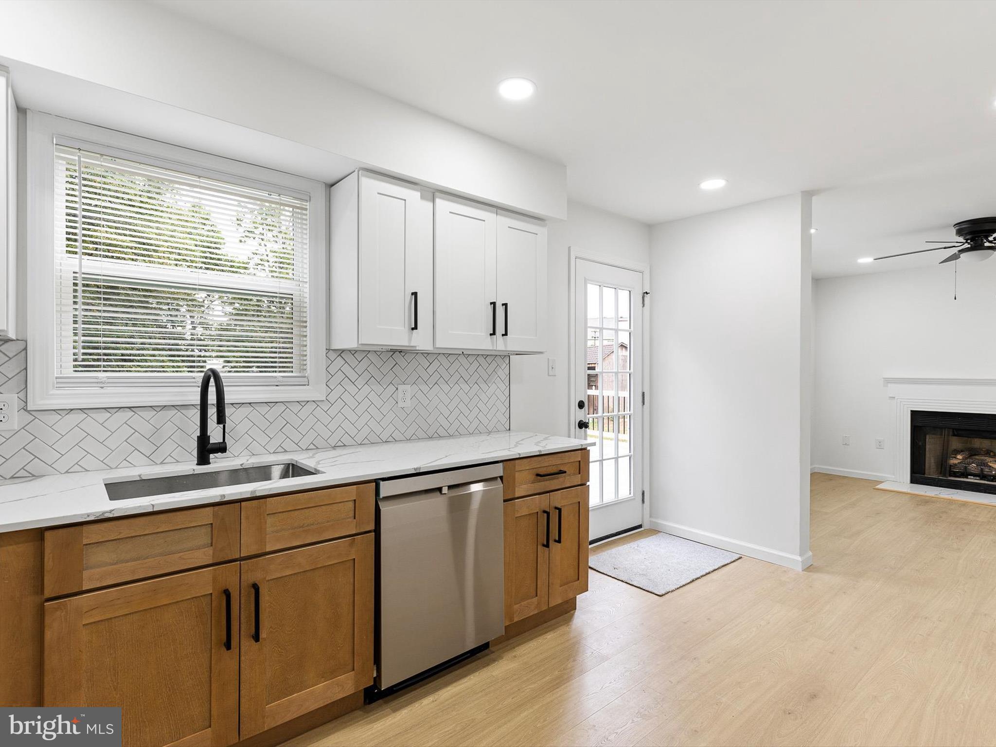 14 3 Rivers Court Newark, DE 19702 - Photo 3 of 21 a kitchen with a sink stove and cabinets