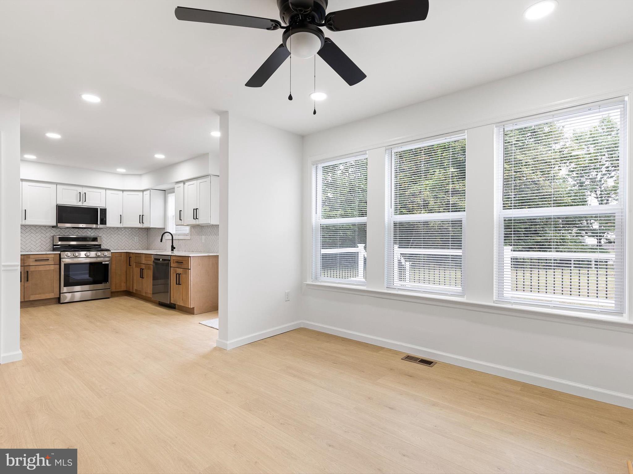 14 3 Rivers Court Newark, DE 19702 - Photo 5 of 21 a view of kitchen with microwave and window