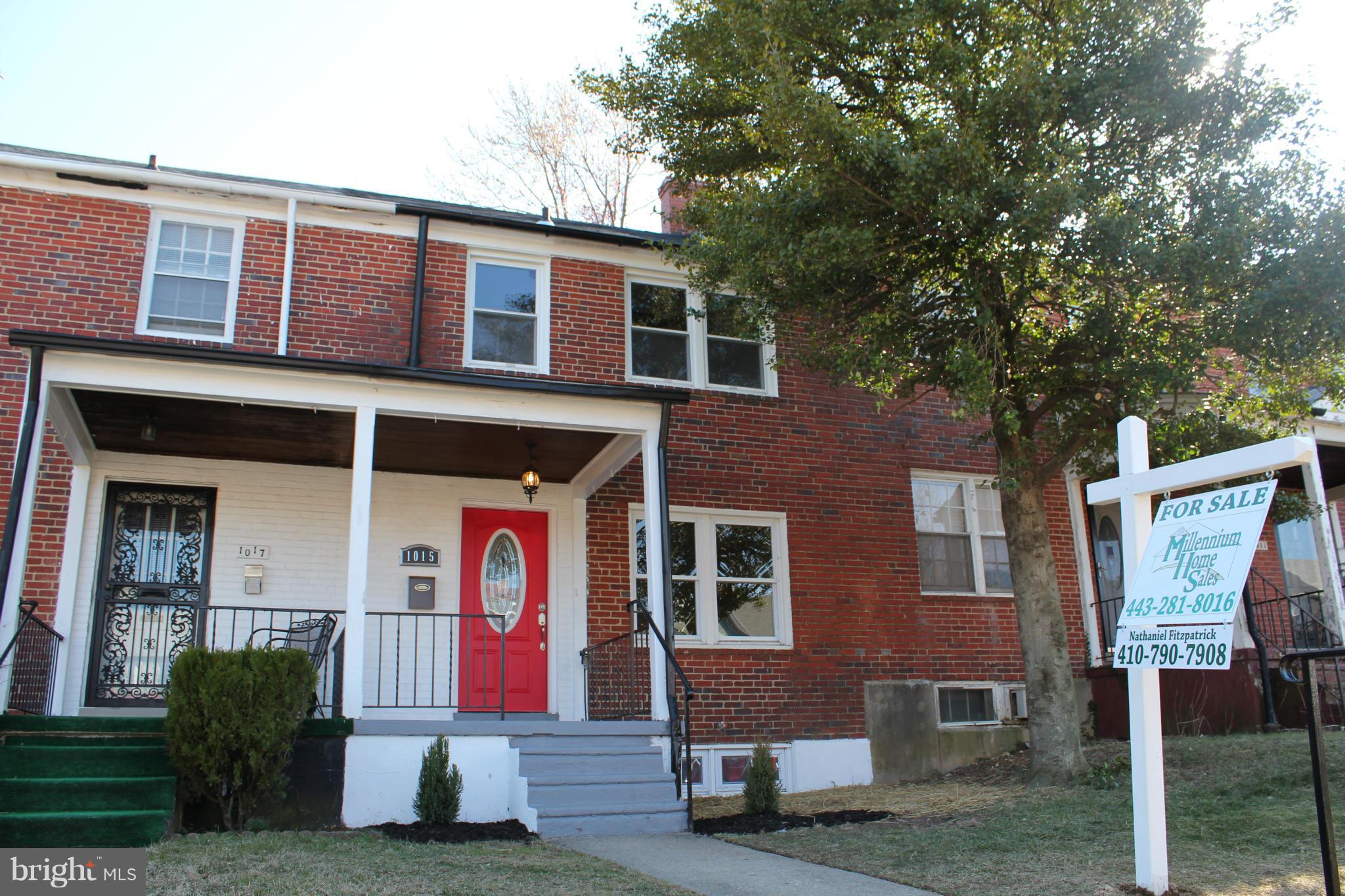 1015 Upnor Road Baltimore, MD 21212 - Photo 1 of 30 a front view of houses with yard