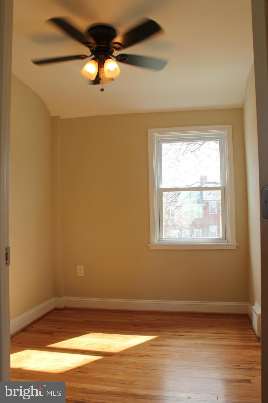 1015 Upnor Road Baltimore, MD 21212 - Photo 14 of 30 a view of a room with wooden floor and a window