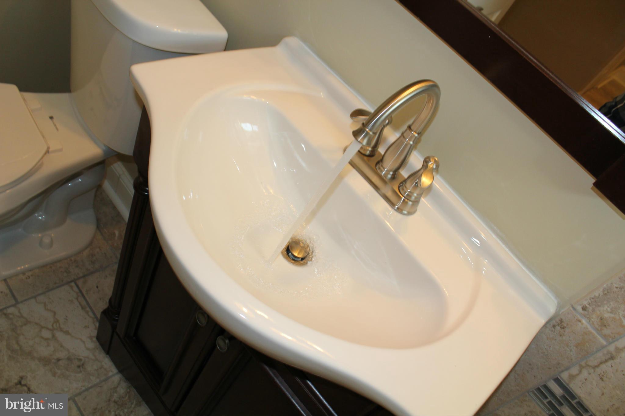 1015 Upnor Road Baltimore, MD 21212 - Photo 26 of 30 a bathroom with a sink