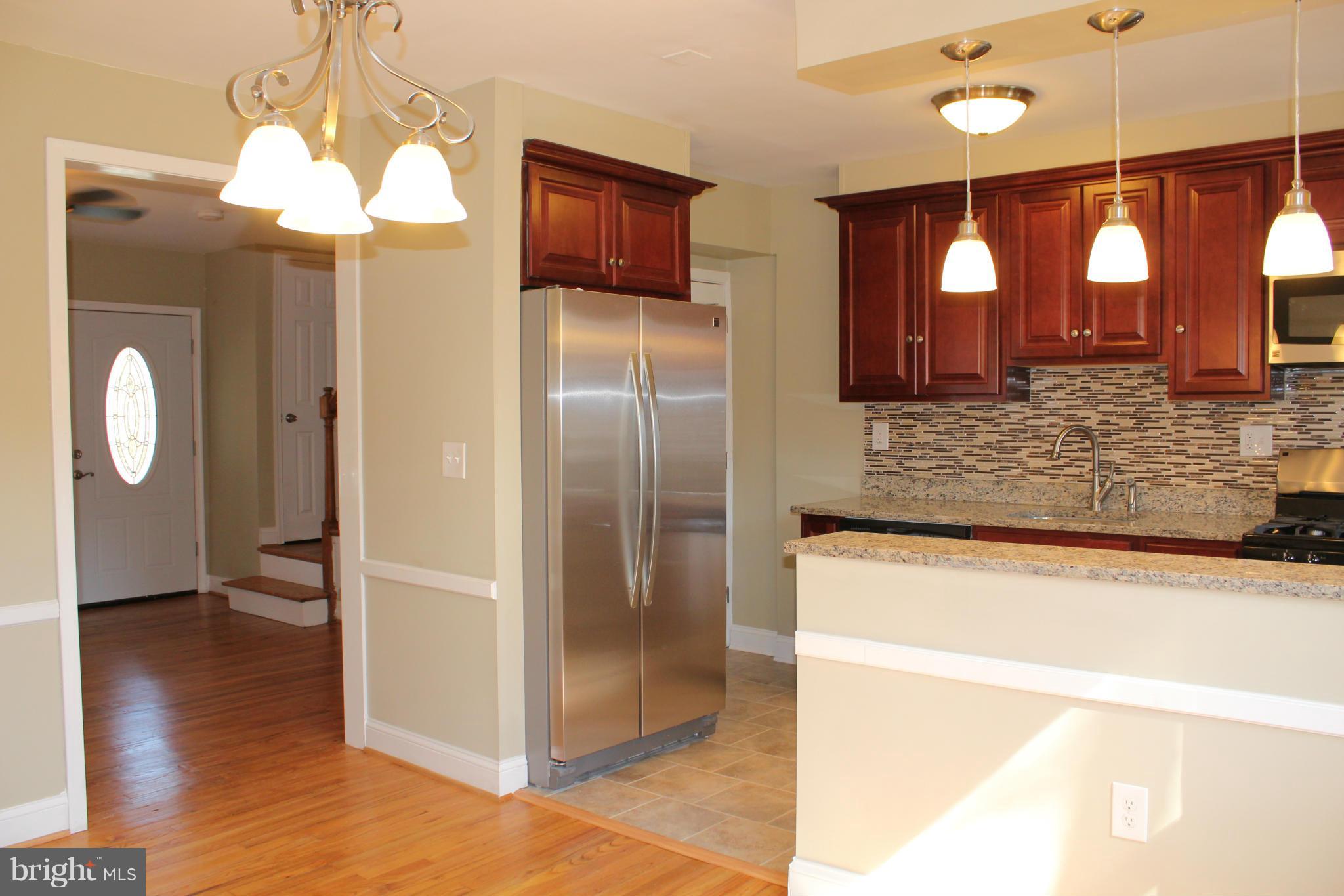 1015 Upnor Road Baltimore, MD 21212 - Photo 7 of 30 a view of kitchen with granite countertop cabinets and refrigerator