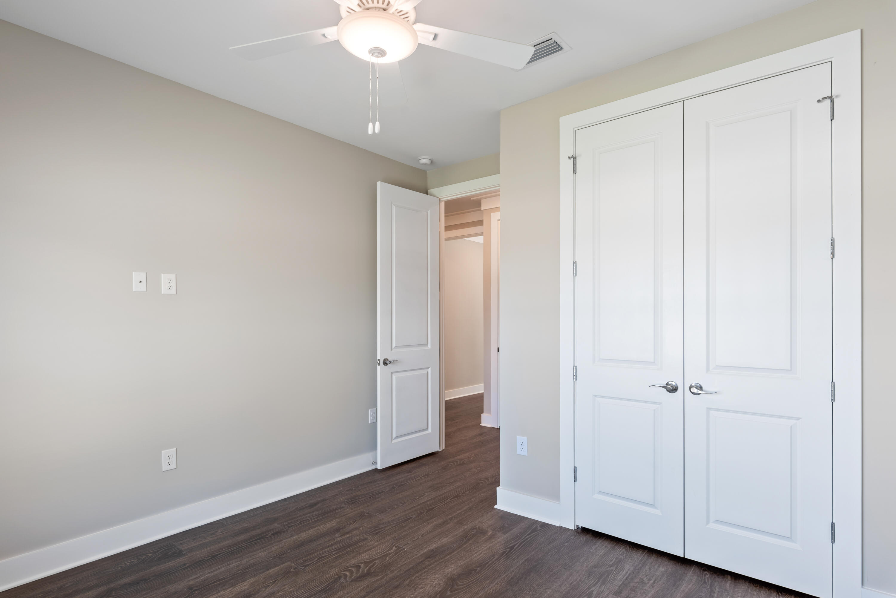 22801 Ann Miller Road Panama City Beach, FL 32413 - Photo 13 of 52 an empty room with wooden floor