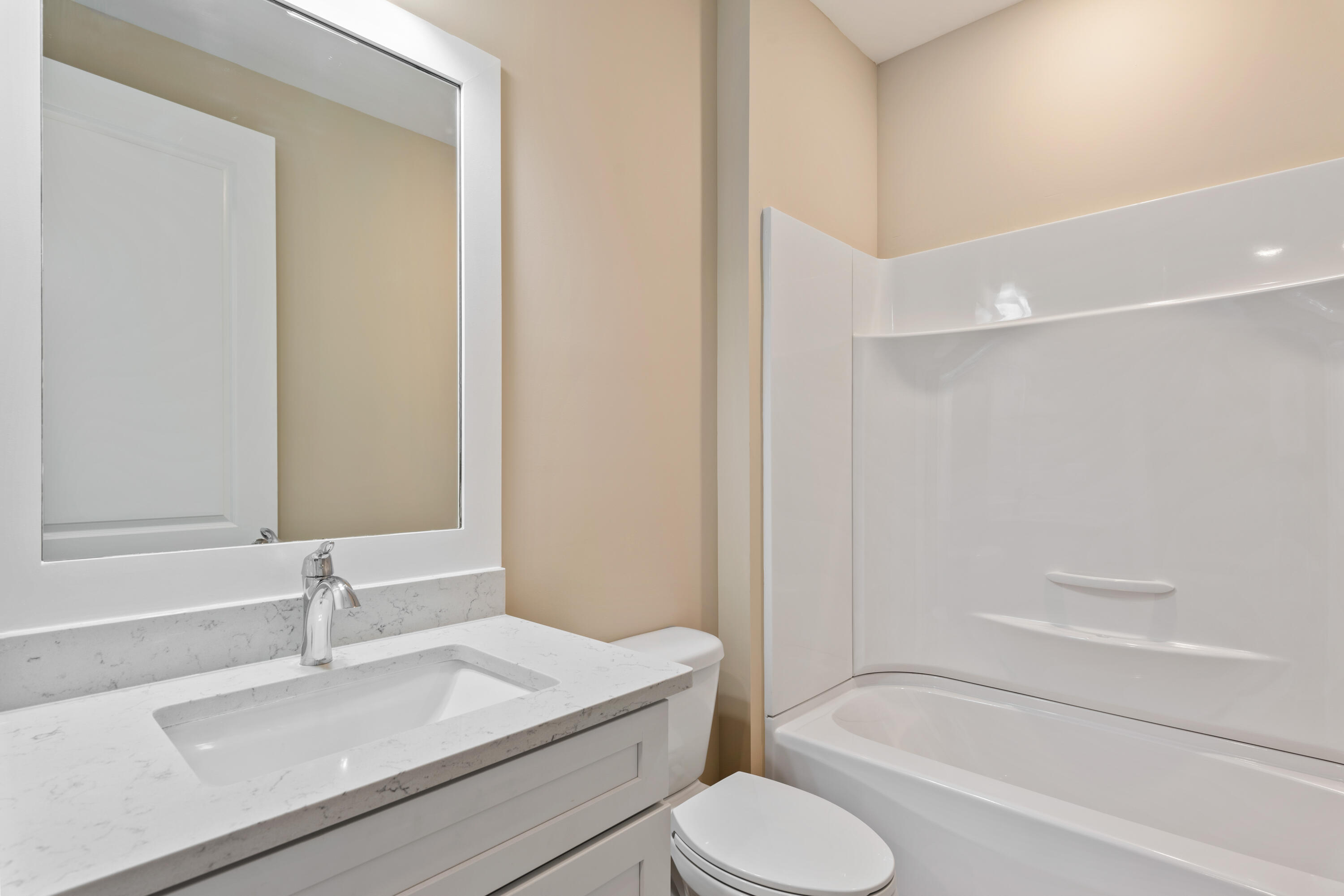 22801 Ann Miller Road Panama City Beach, FL 32413 - Photo 14 of 52 a bathroom with a sink toilet and shower