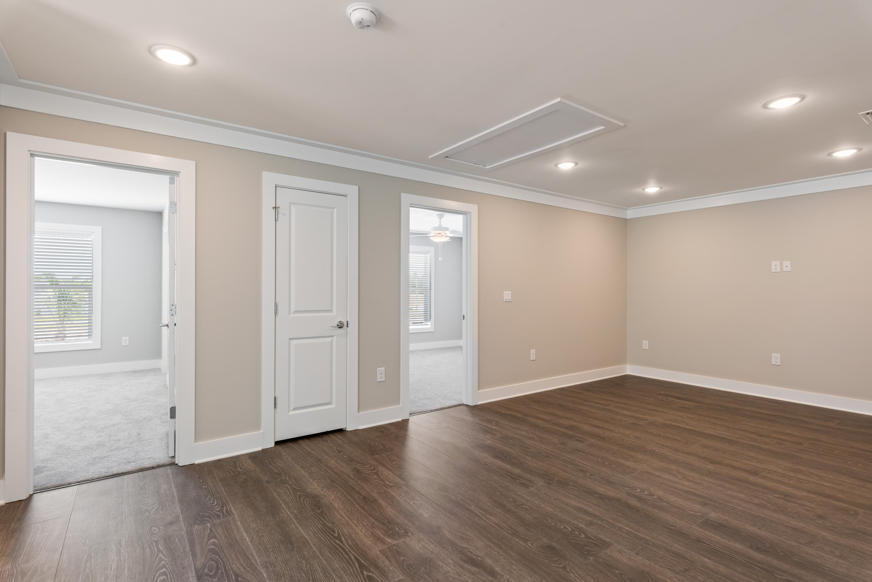 22801 Ann Miller Road Panama City Beach, FL 32413 - Photo 15 of 52 an empty room with wooden floor and windows