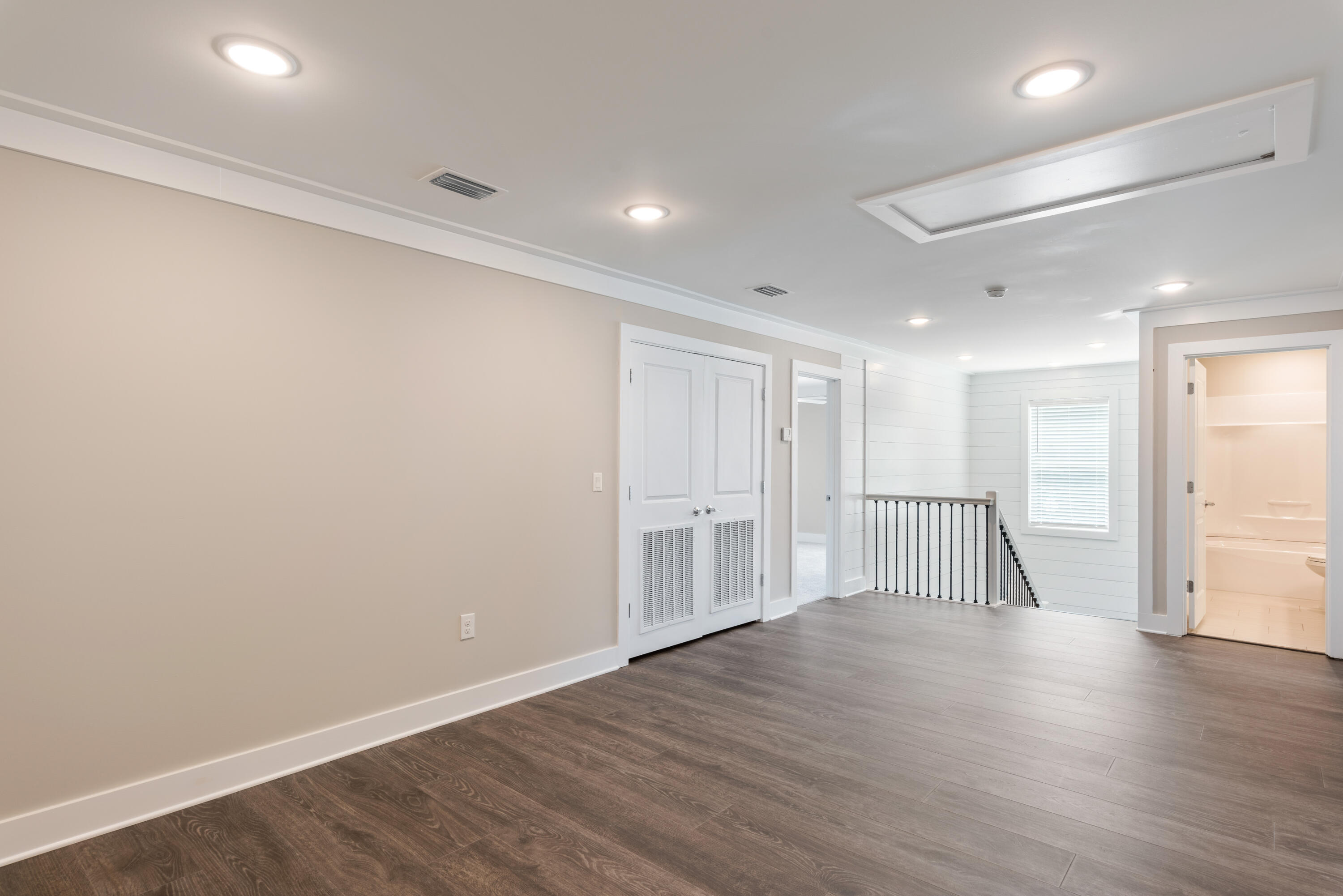 22801 Ann Miller Road Panama City Beach, FL 32413 - Photo 16 of 52 a view of empty room with wooden floor