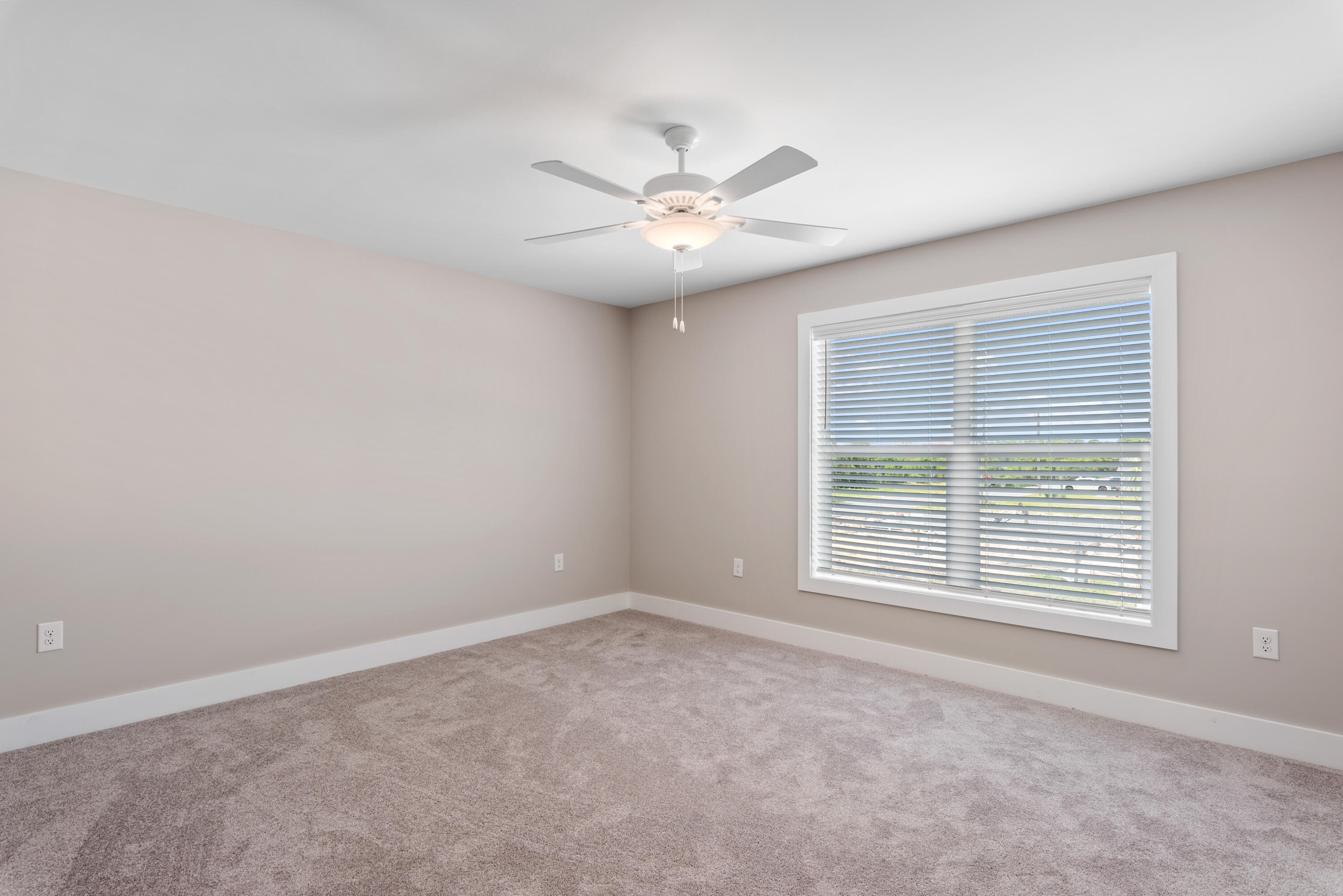 22801 Ann Miller Road Panama City Beach, FL 32413 - Photo 17 of 52 an empty room with windows and fan