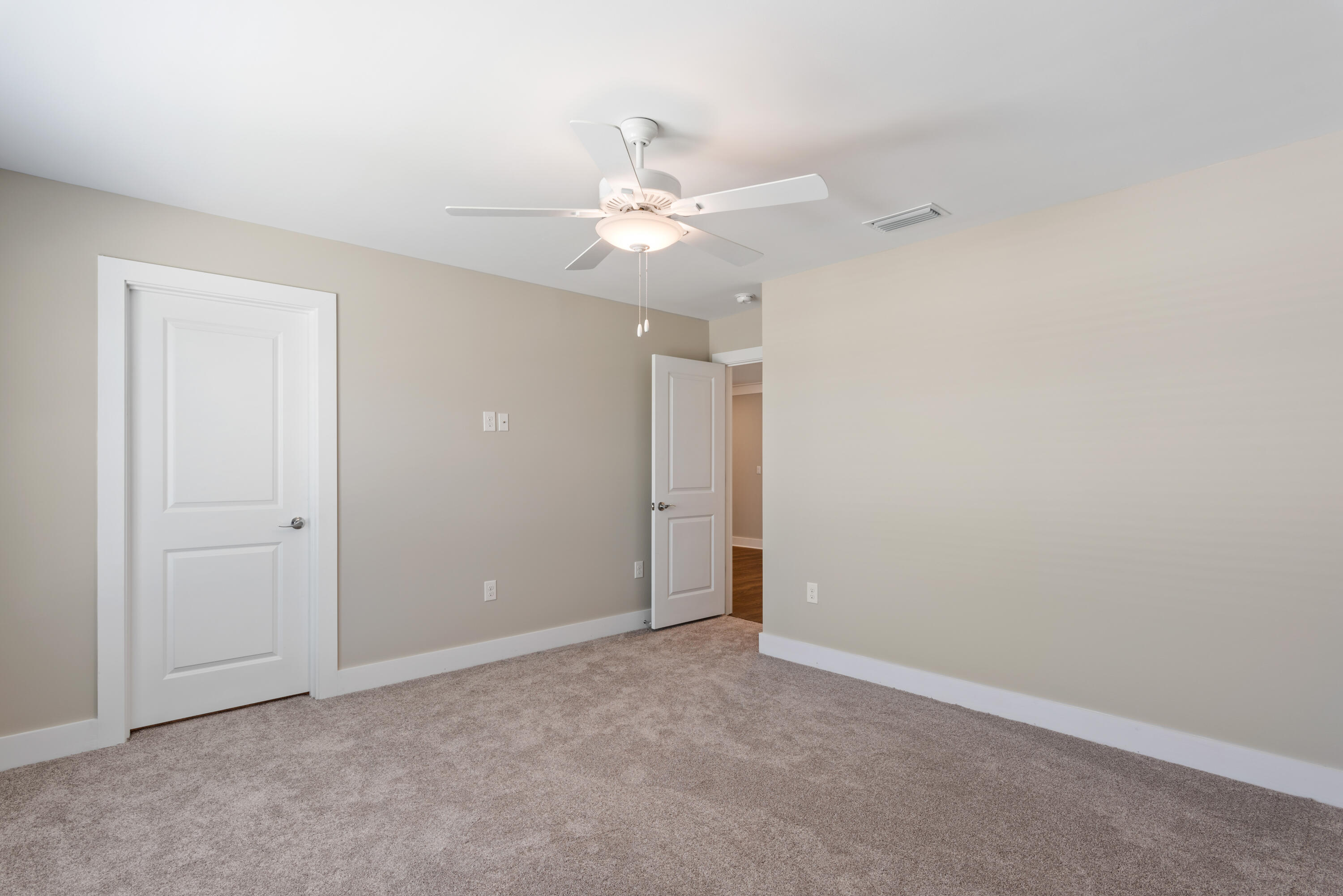 22801 Ann Miller Road Panama City Beach, FL 32413 - Photo 18 of 52 an empty room with closet and a ceiling fan