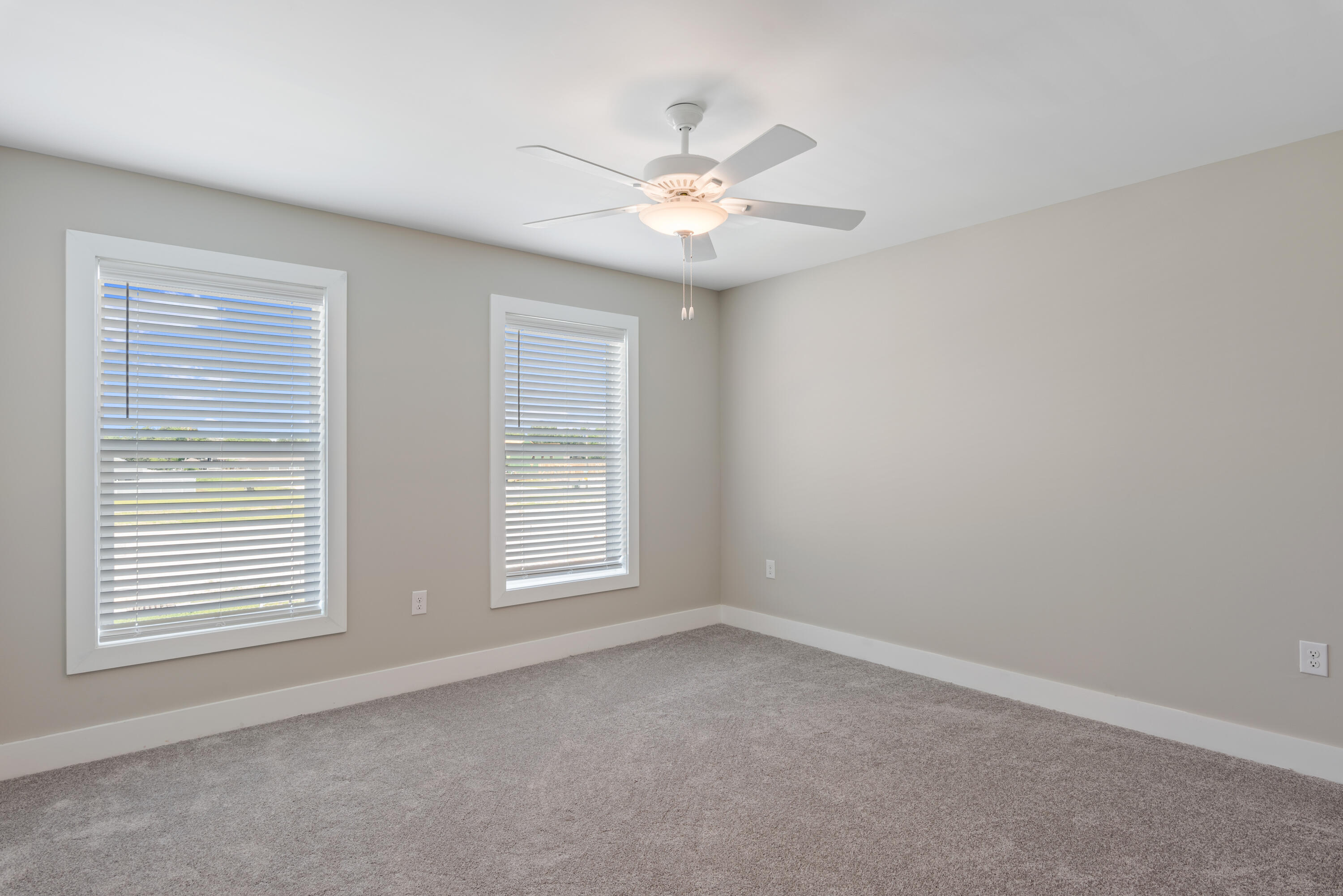 22801 Ann Miller Road Panama City Beach, FL 32413 - Photo 20 of 52 an empty room with windows and fan