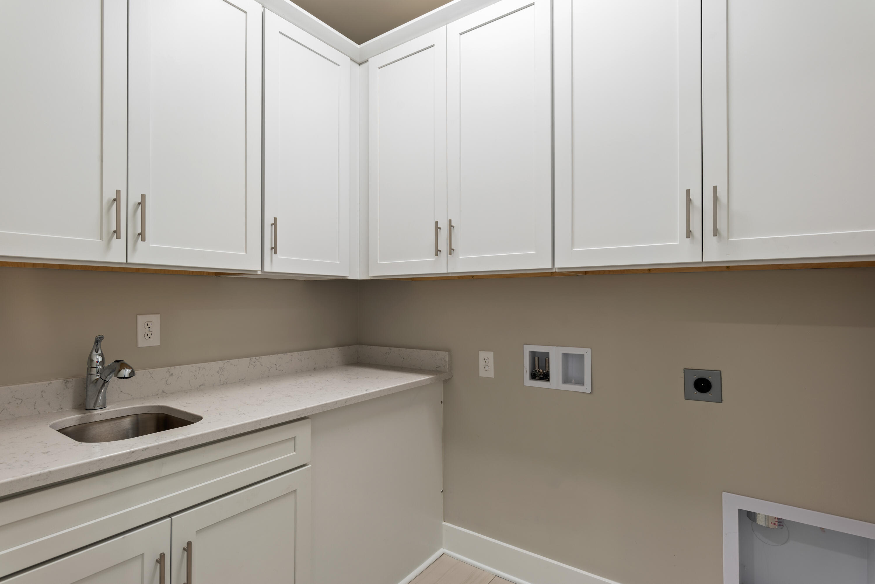 22801 Ann Miller Road Panama City Beach, FL 32413 - Photo 25 of 52 a kitchen with stainless steel appliances granite countertop white cabinets and a sink