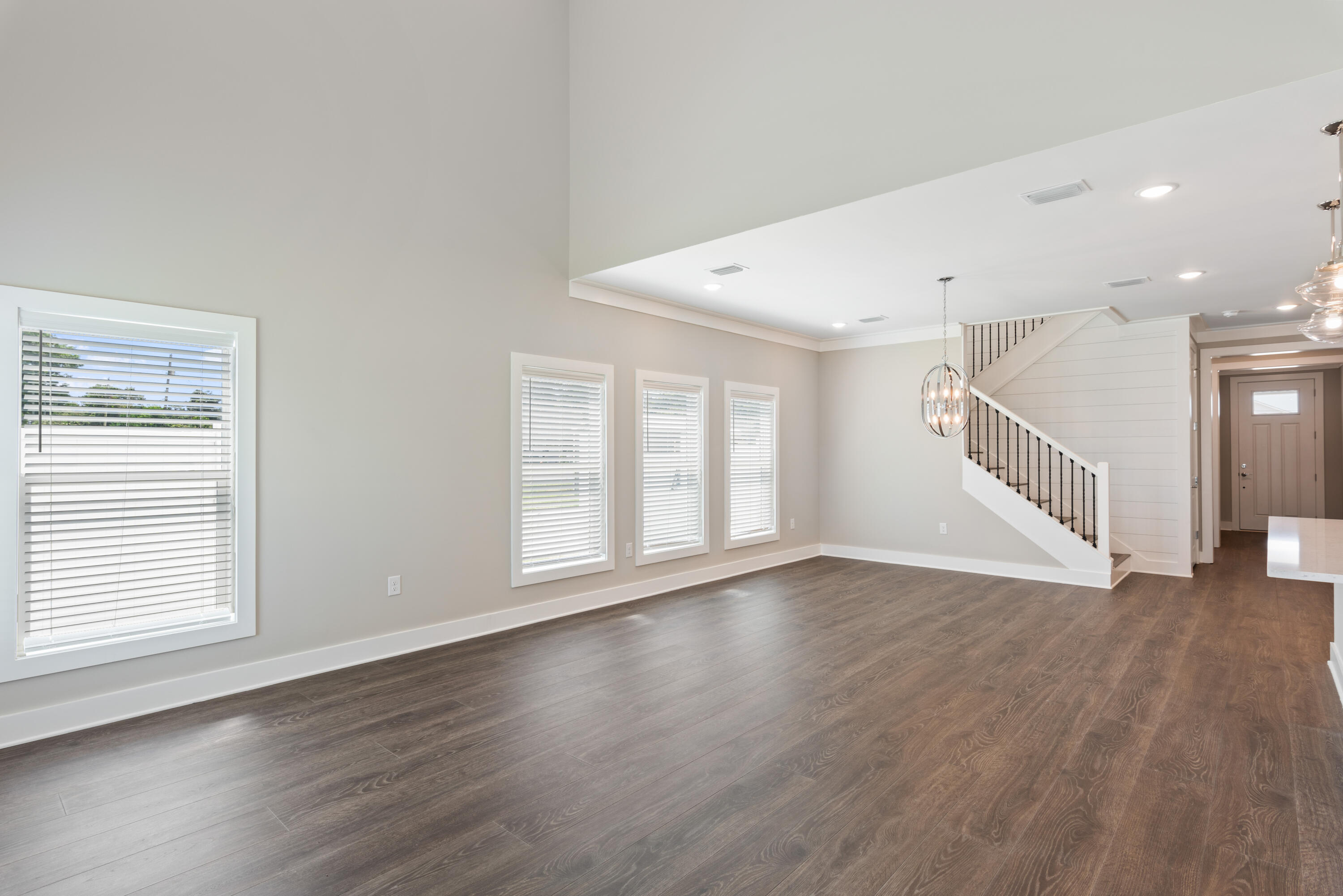 22801 Ann Miller Road Panama City Beach, FL 32413 - Photo 3 of 52 a view of an empty room with wooden floor and a window