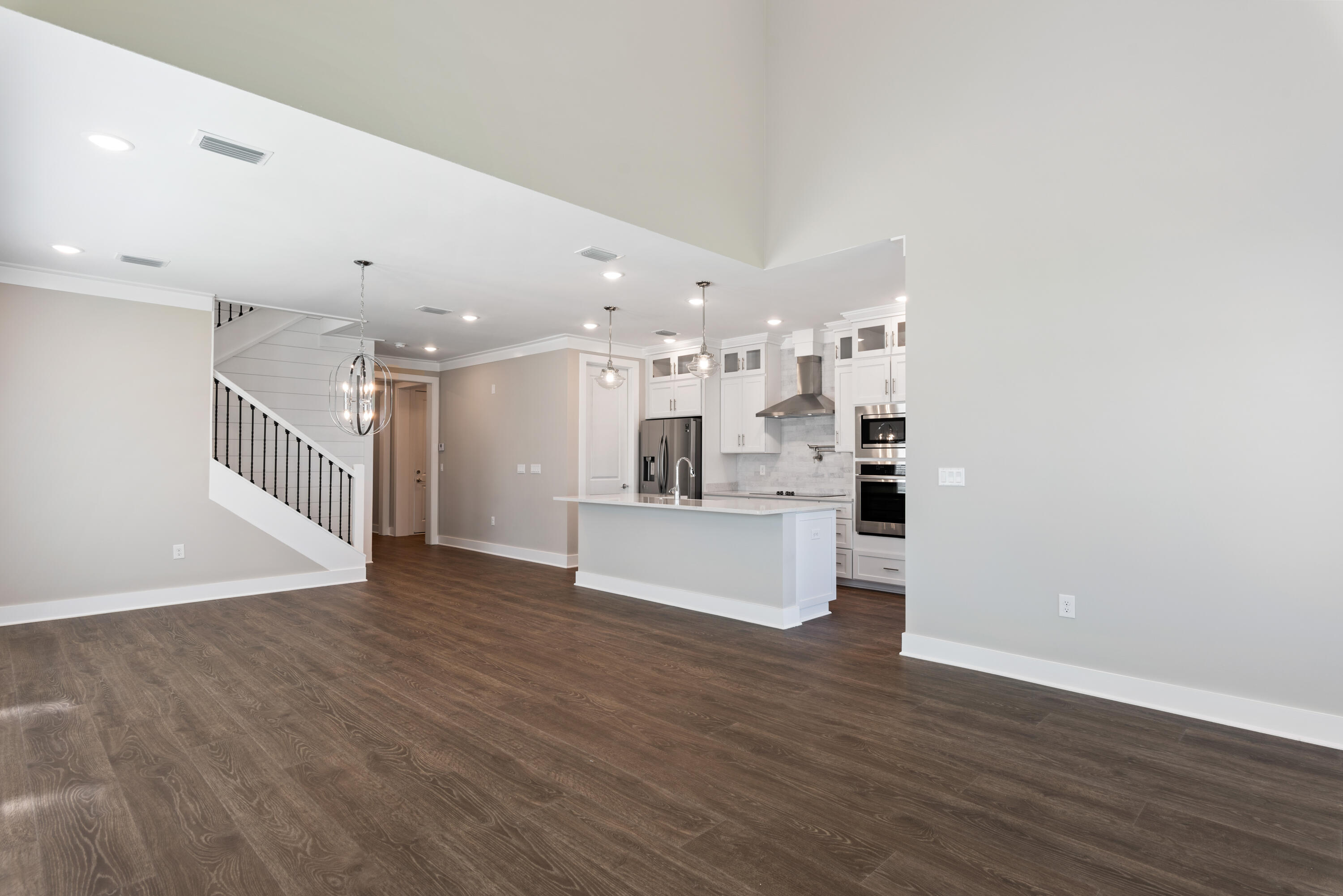 22801 Ann Miller Road Panama City Beach, FL 32413 - Photo 4 of 52 a view of kitchen and kitchen with wooden floor