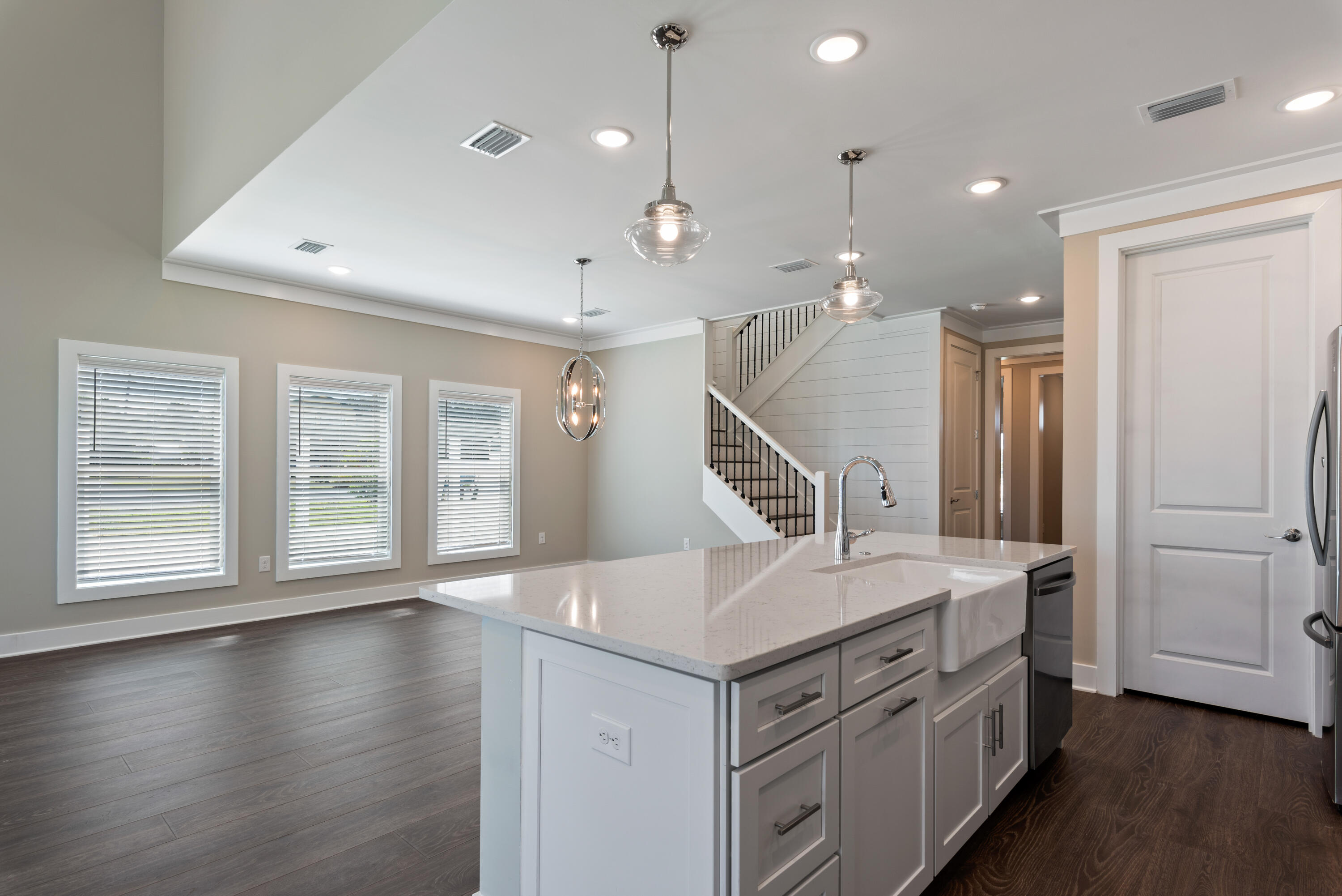 22801 Ann Miller Road Panama City Beach, FL 32413 - Photo 6 of 52 a kitchen with a sink and wooden floor
