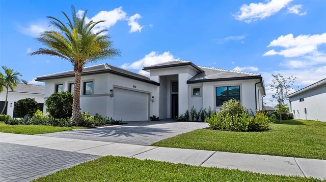 a front view of house with yard and green space
