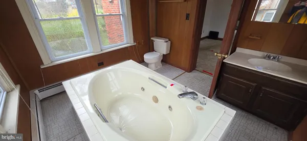 a bathroom with a bathtub sink and toilet