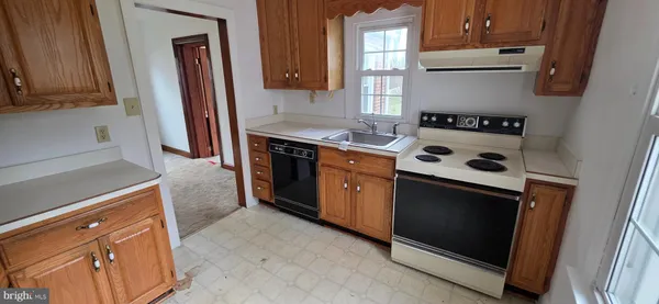 a kitchen with a stove and a microwave
