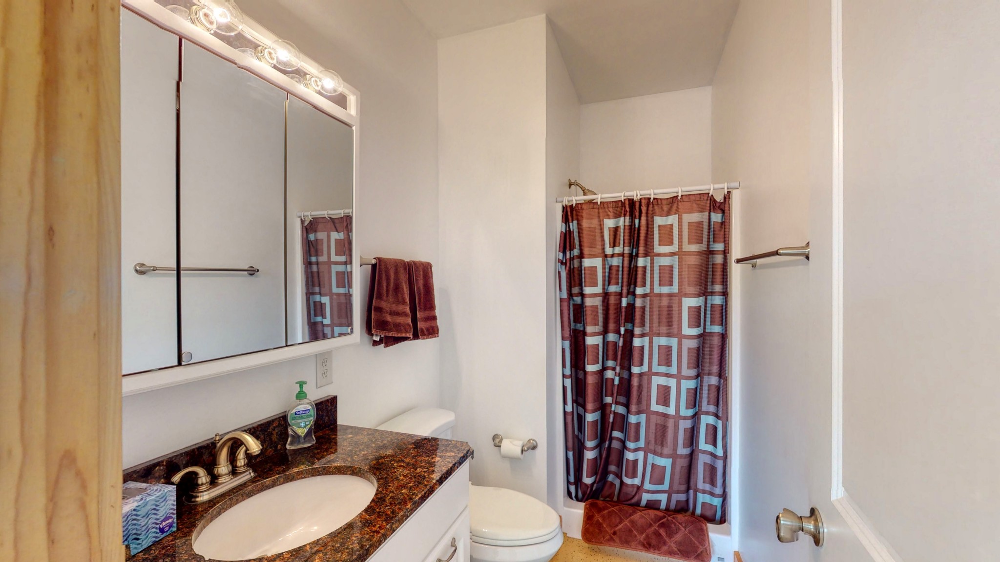 650 Humphrey Road Huntingdon, TN 38344 - Photo 12 of 24 a bathroom with a sink a toilet and shower curtain