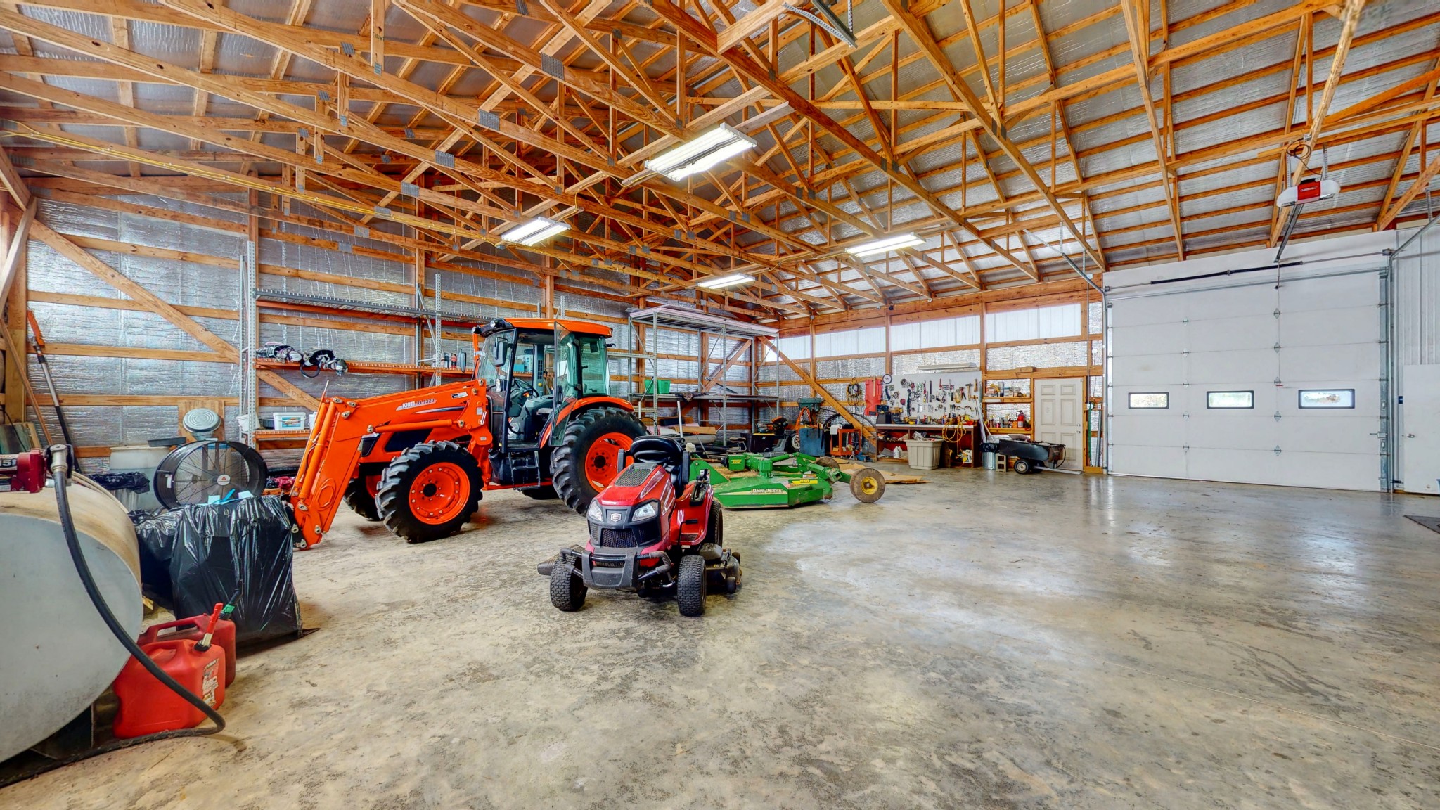 650 Humphrey Road Huntingdon, TN 38344 - Photo 16 of 24 a view of a garage with a bike and wooden roof