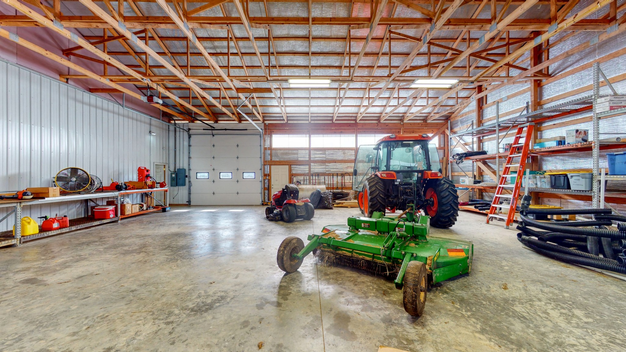 650 Humphrey Road Huntingdon, TN 38344 - Photo 17 of 24 a view of a garage with a car and car parked