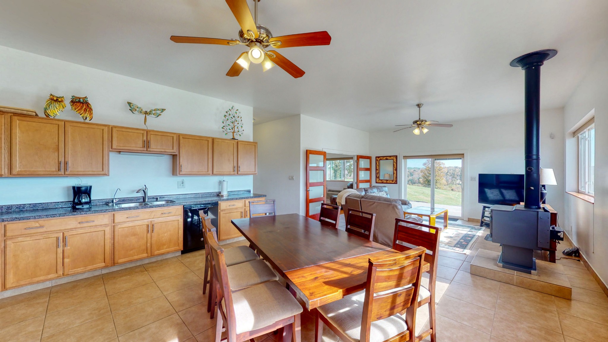 650 Humphrey Road Huntingdon, TN 38344 - Photo 5 of 24 a kitchen with a table chairs and a refrigerator