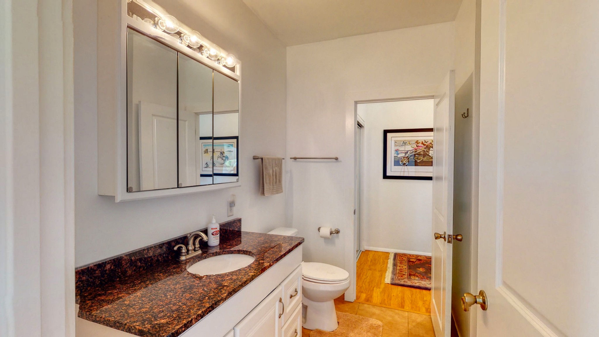 650 Humphrey Road Huntingdon, TN 38344 - Photo 9 of 24 a bathroom with a granite countertop sink and a mirror