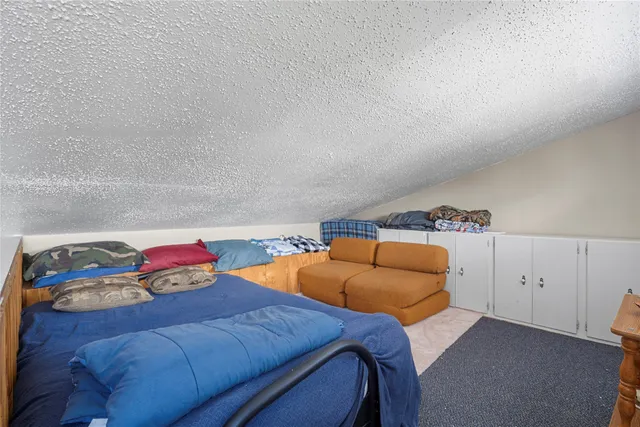 a bedroom with a bed and a closet