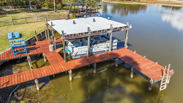 a roof deck with table and chairs a barbeque