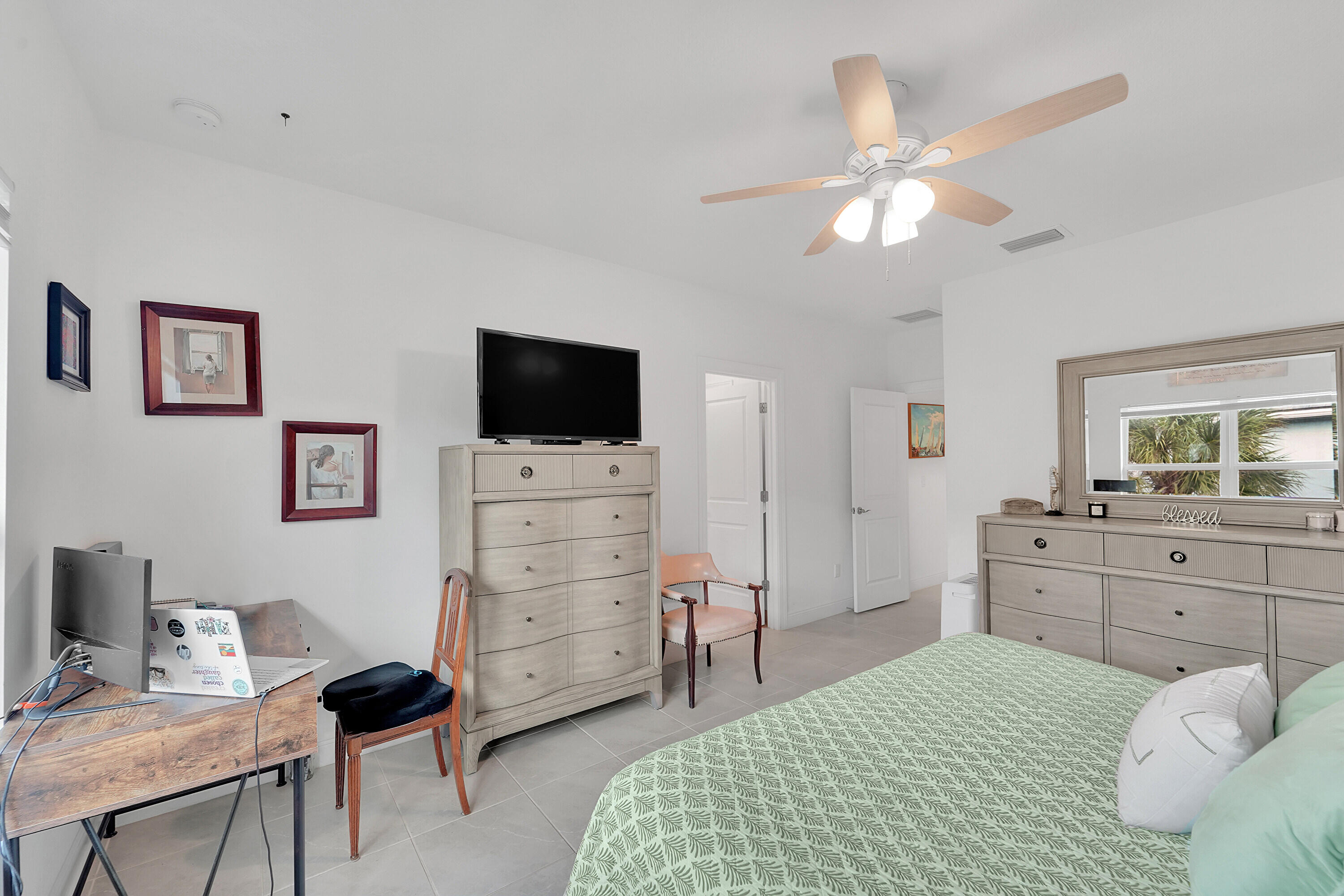 1821 Sandpiper Pointe Place, Unit 1821 Deerfield Beach, FL 33442 - Photo 11 of 24 a bedroom with a bed and a flat screen tv