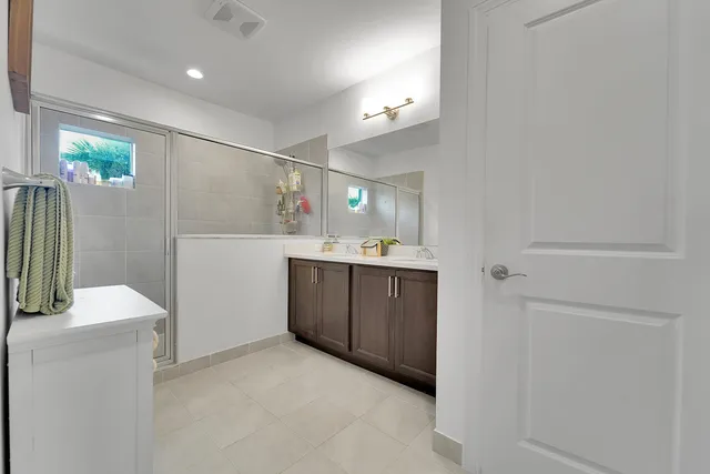 a kitchen with a sink and refrigerator