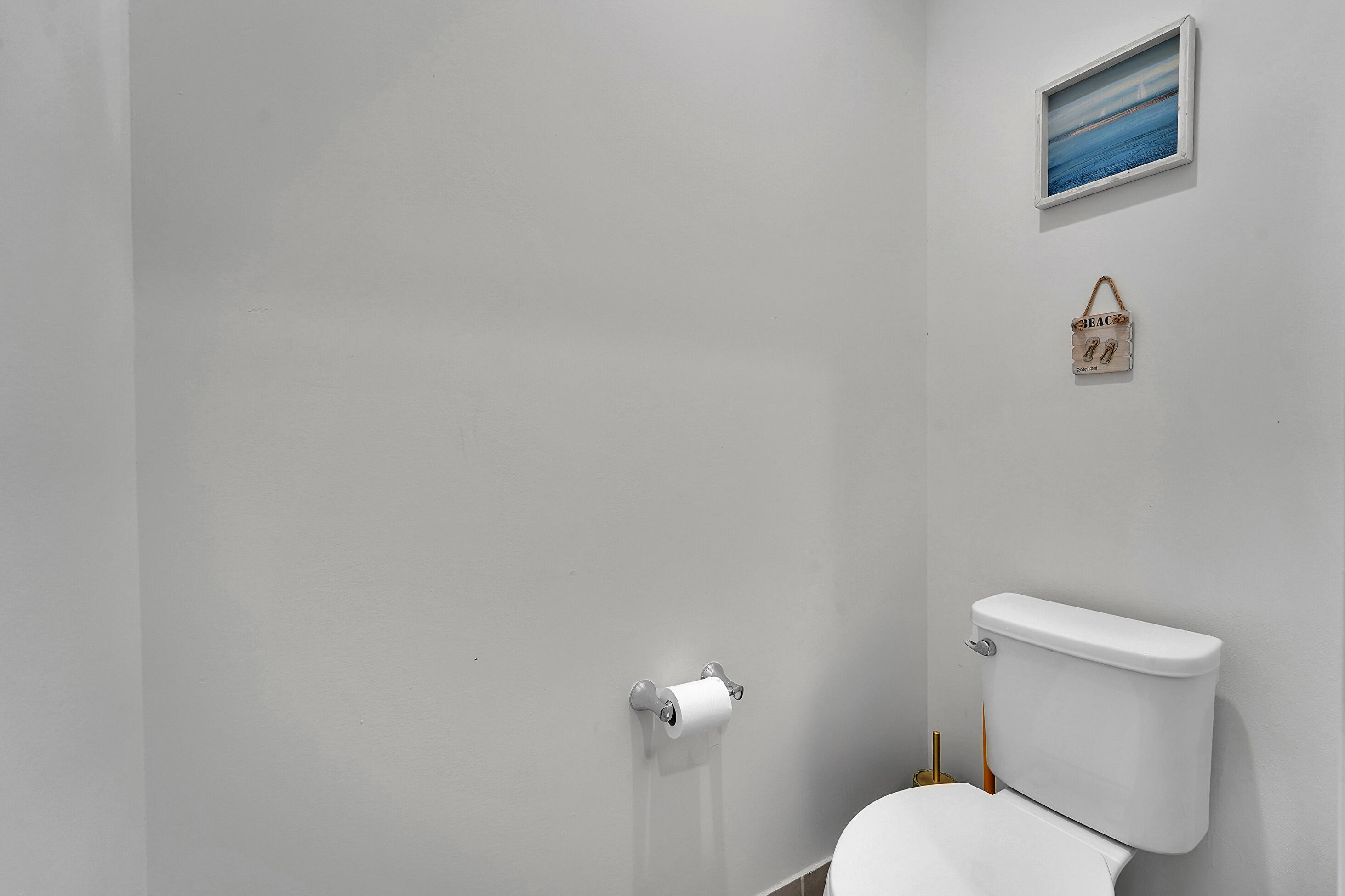 1821 Sandpiper Pointe Place, Unit 1821 Deerfield Beach, FL 33442 - Photo 14 of 24 a white toilet sitting next to a white wall