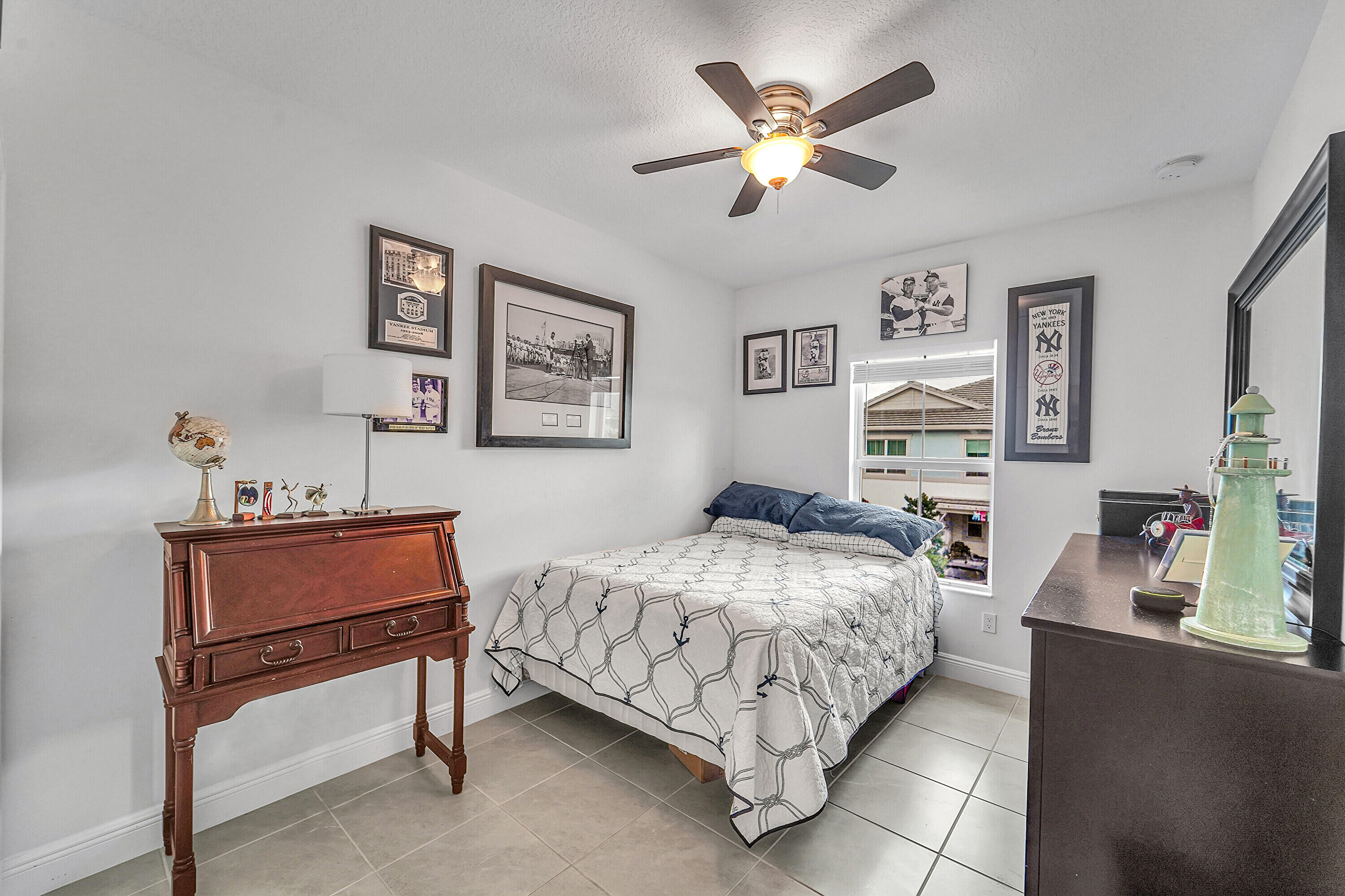 1821 Sandpiper Pointe Place, Unit 1821 Deerfield Beach, FL 33442 - Photo 15 of 24 a bedroom with a bed and a chandelier