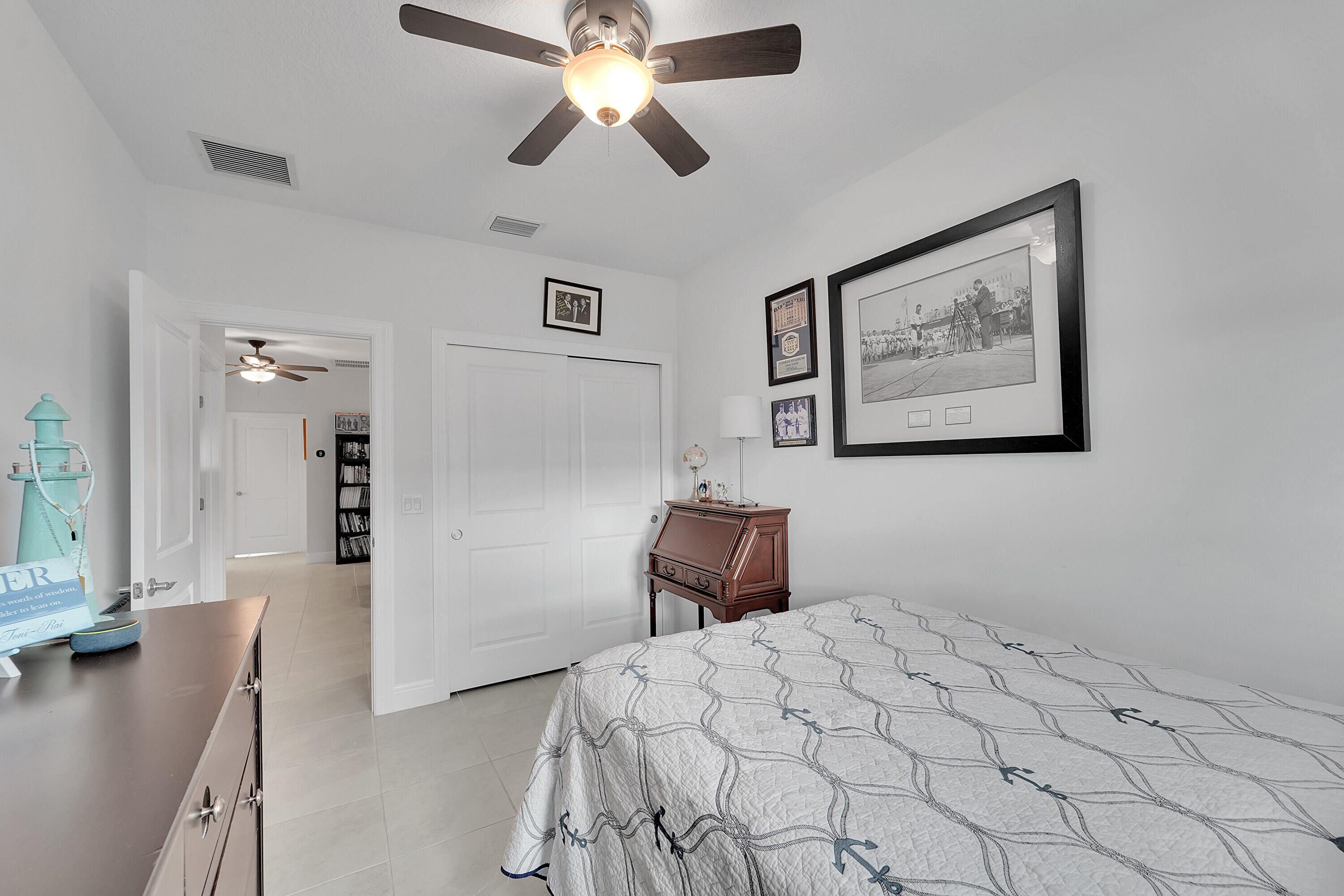 1821 Sandpiper Pointe Place, Unit 1821 Deerfield Beach, FL 33442 - Photo 17 of 24 a bedroom with a large bed and a chandelier