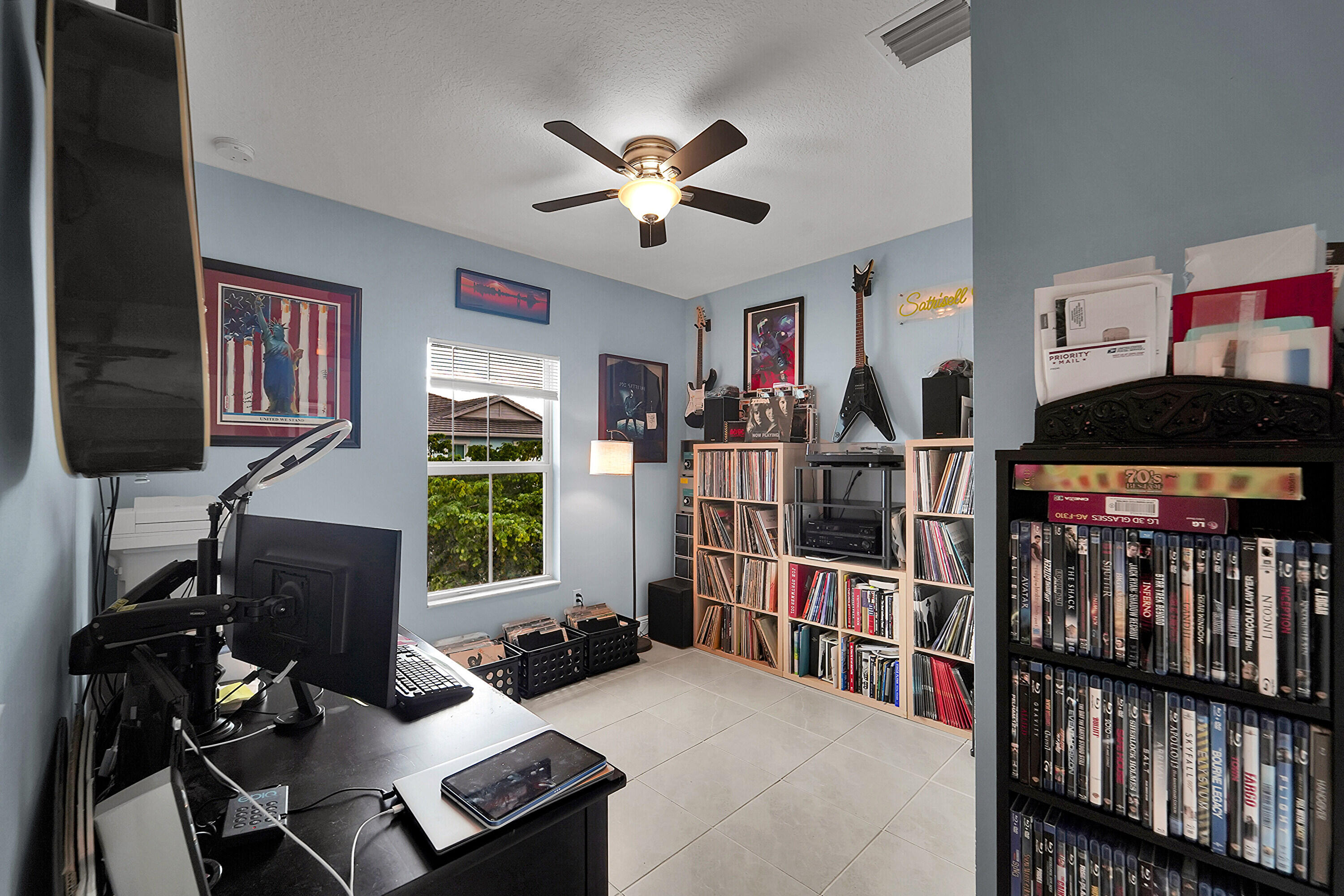 1821 Sandpiper Pointe Place, Unit 1821 Deerfield Beach, FL 33442 - Photo 18 of 24 a living room with lots of furniture and a book shelf