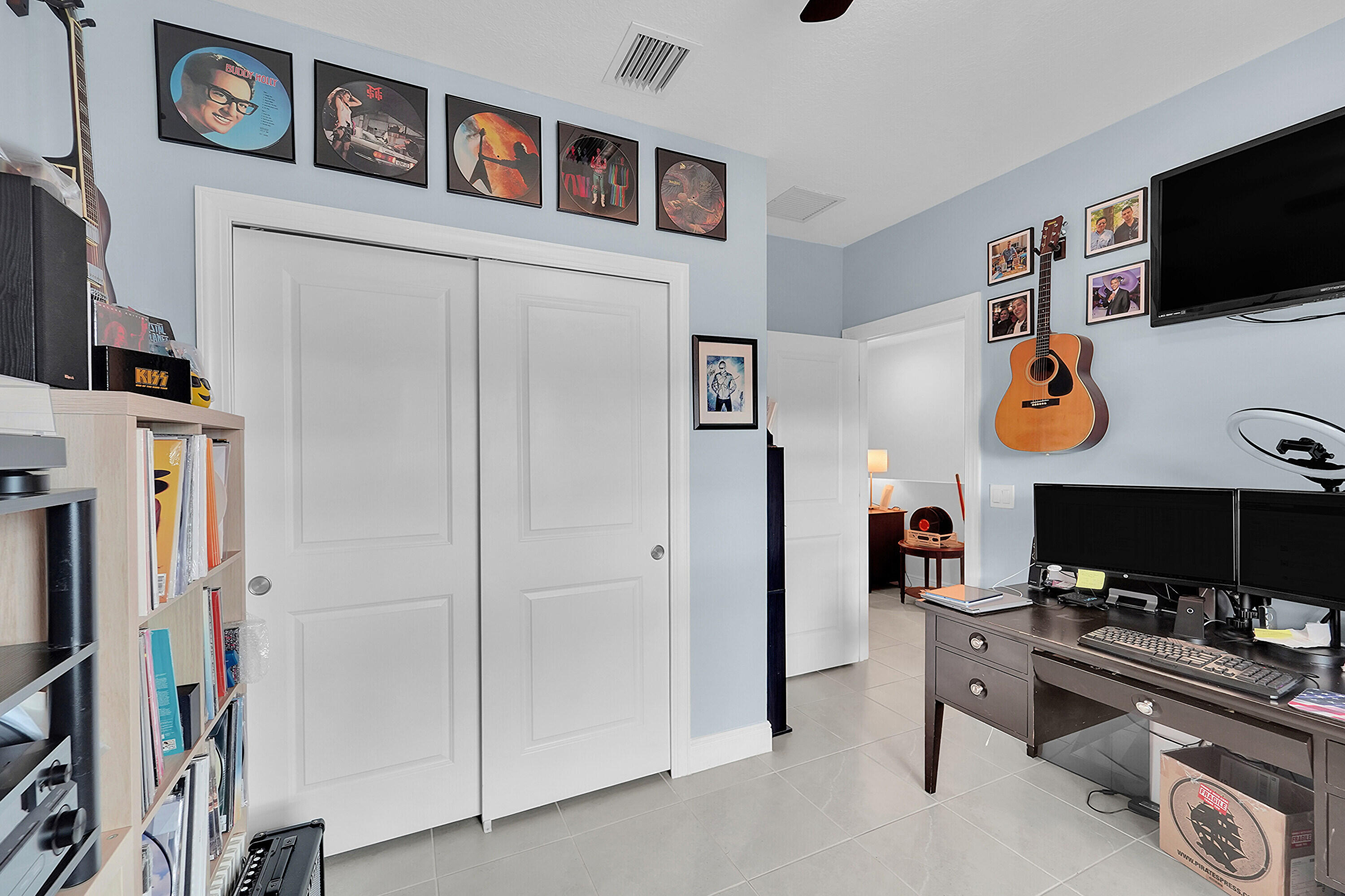 1821 Sandpiper Pointe Place, Unit 1821 Deerfield Beach, FL 33442 - Photo 19 of 24 a room with furniture and a flat screen tv