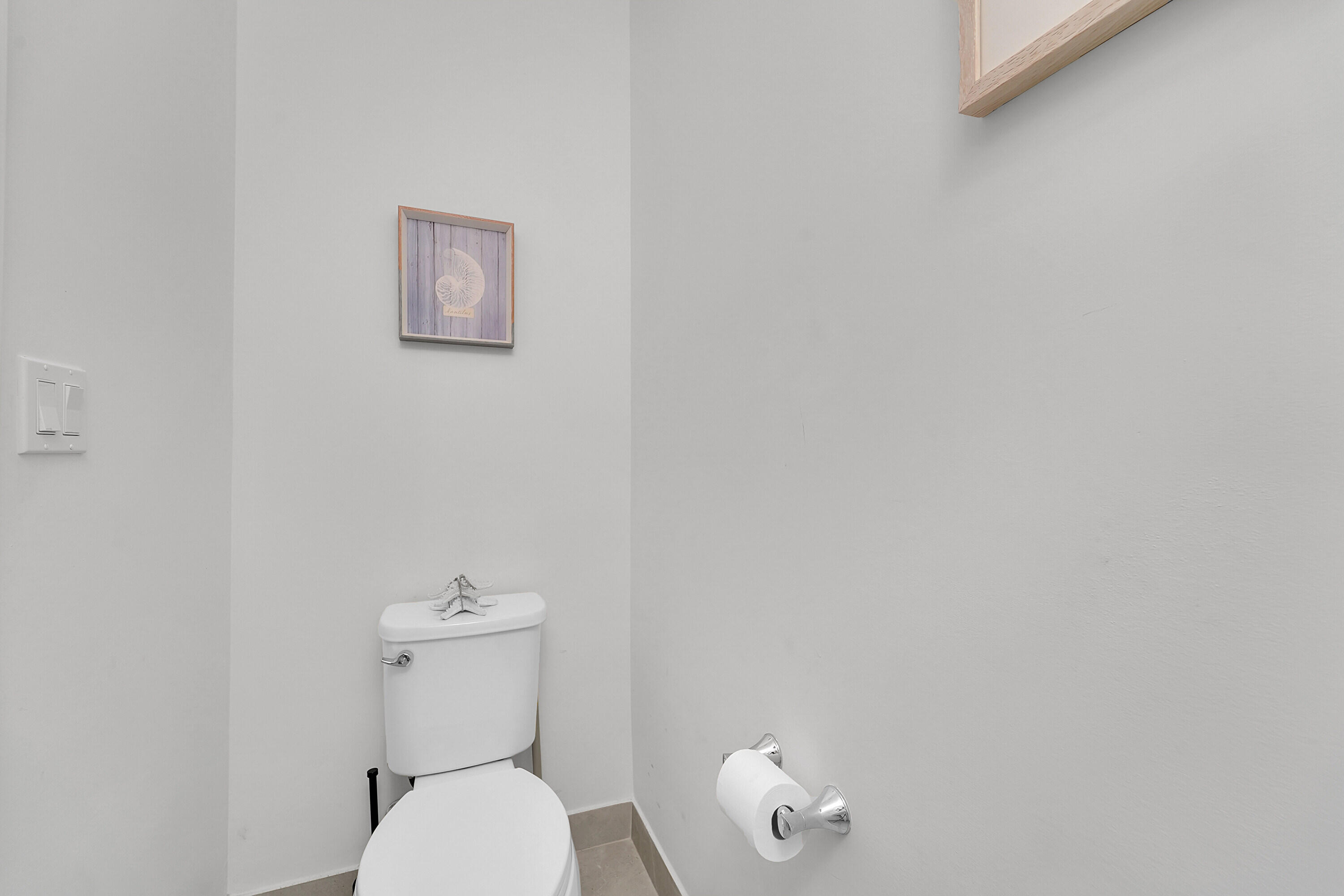 1821 Sandpiper Pointe Place, Unit 1821 Deerfield Beach, FL 33442 - Photo 21 of 24 a white toilet sitting next to a white walls
